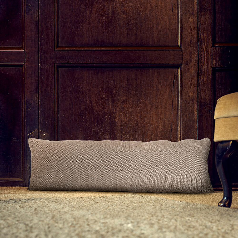 Brown weave Organic Cotton Door Draught Excluder in place behind door