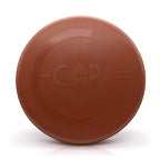A round terracotta-colored Chimney Cap with embossed branding and text, shown on a clean white background.
