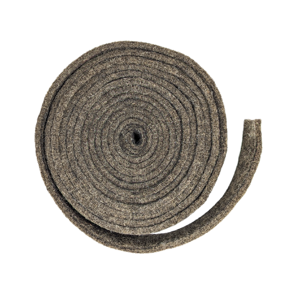A coiled roll of textured gray felt or fabric insulation material, shown on a plain white background.