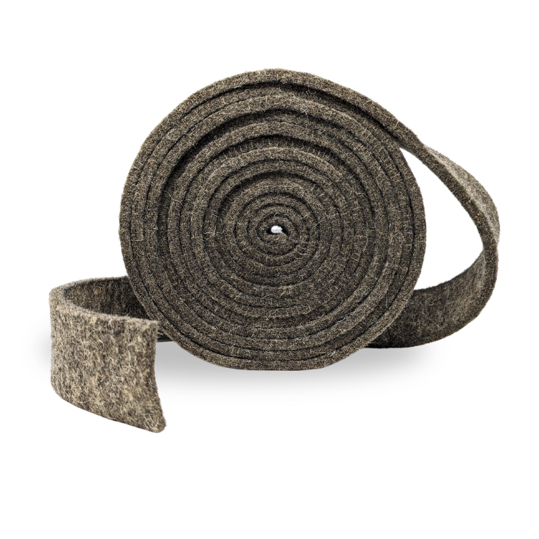 A roll of dark grey wool pipe lagging with a textured, heathered finish, shown partially unrolled on a clean white background.