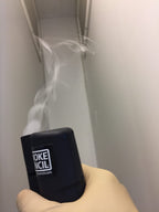 Showing man holding smoke pecil testing into application on vents
